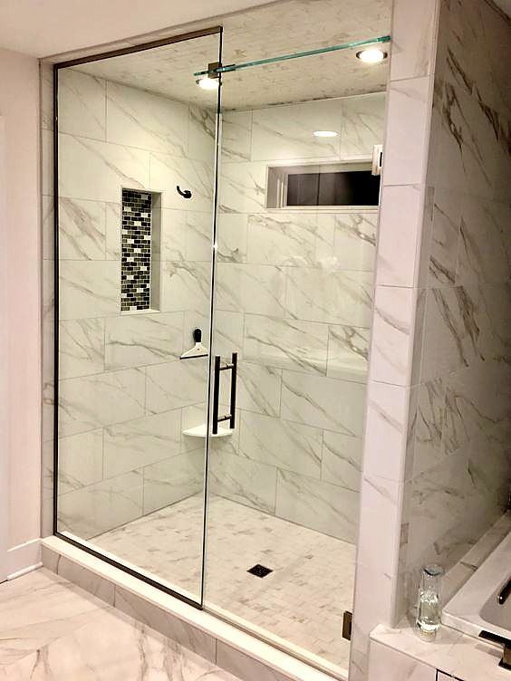 Floor-to-ceiling steam shower glass enclosure by Shower Enclosures by George